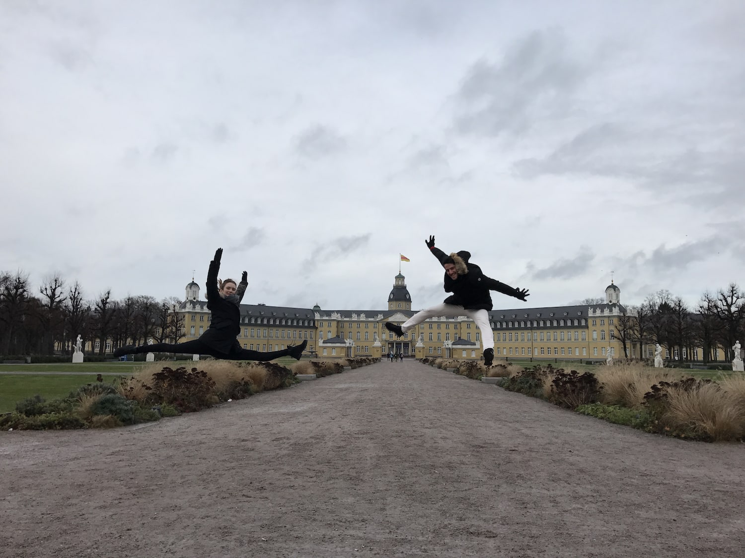 Jumping in front of Karlsruhe Schloss in Germany