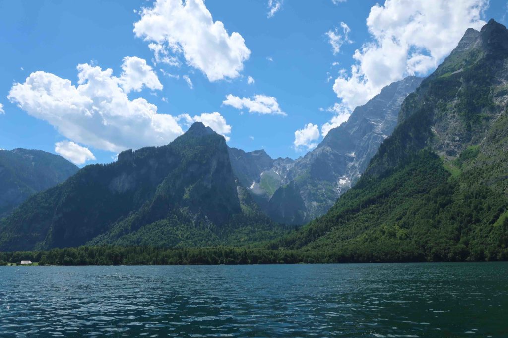 Sailing on the Königsee lake in Germany surrounded by the Alps
