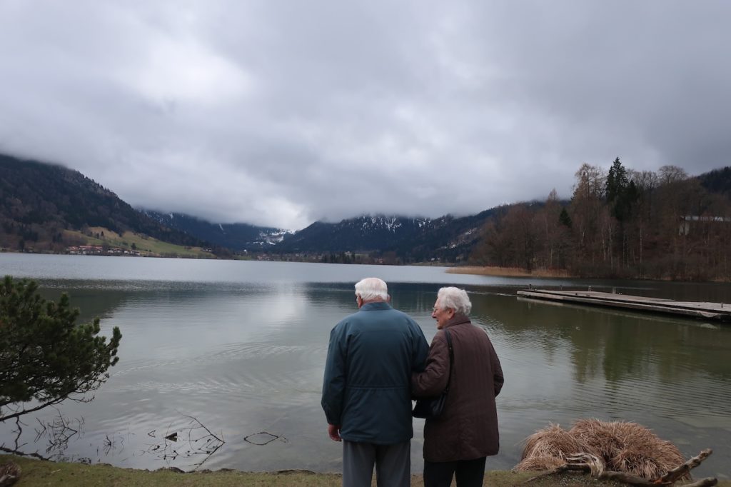 two old man stand on the bank of SCHLIERSEE LAKE